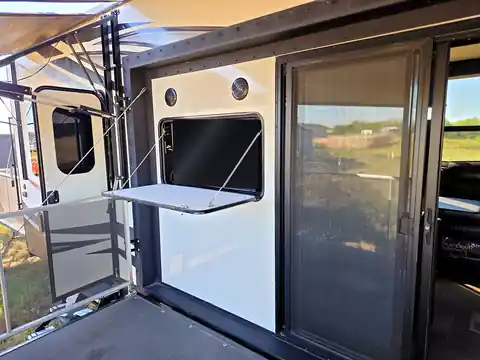 Outdoor patio with 39-inch TV and railing